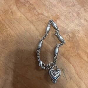 Silver tone link bracelet with a heart charm Retired